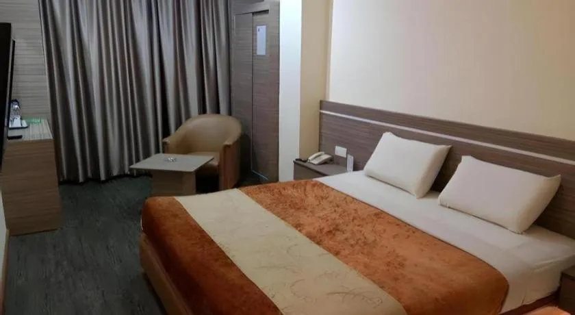 Bed in Holiday Hotel Batam