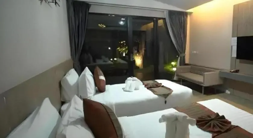 Bed in Chatnipa Beach Resort