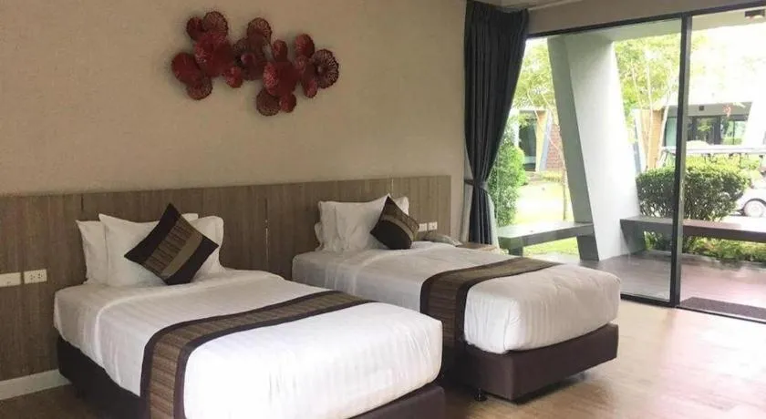 Bed in Chatnipa Beach Resort