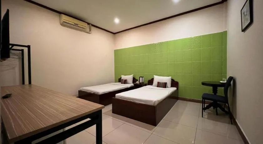 Bed in Souphaphone Hotel