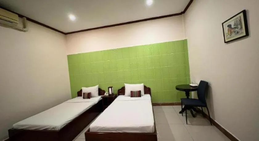 Bed in Souphaphone Hotel