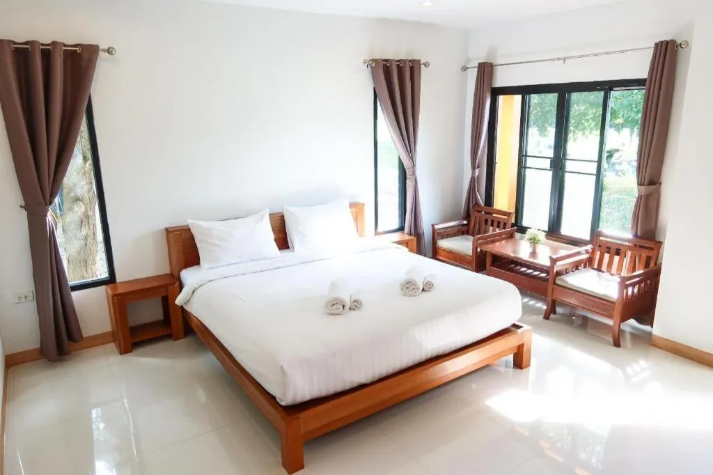 Bed in Baan Klang Suan Resort