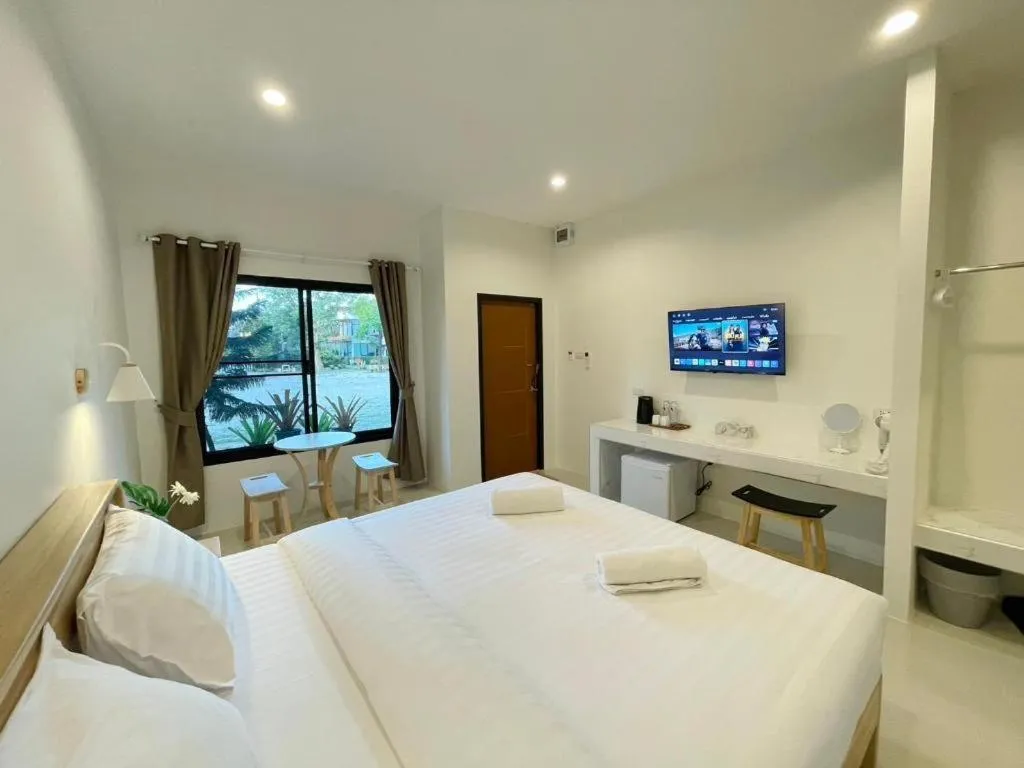 Bed in Baan Klang Suan Resort