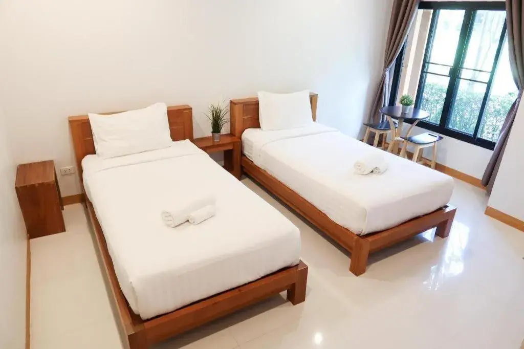 Bed in Baan Klang Suan Resort Bed in Baan Klang Suan Resort