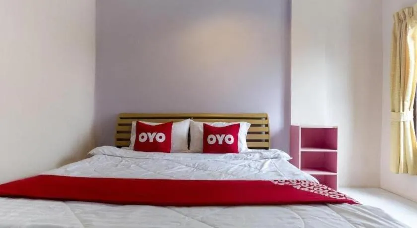 Bed in OYO 75356 Thipsiri Lodge