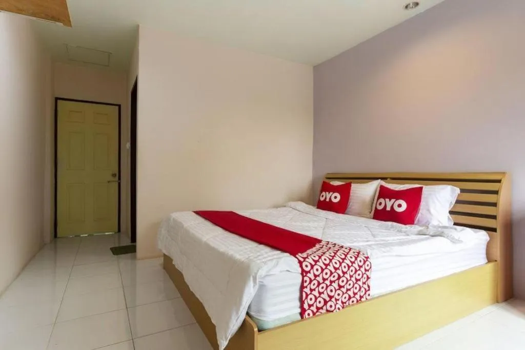 Bed in OYO 75356 Thipsiri Lodge