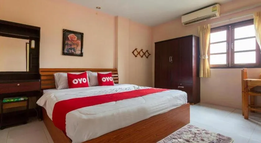 Bed in OYO 75356 Thipsiri Lodge