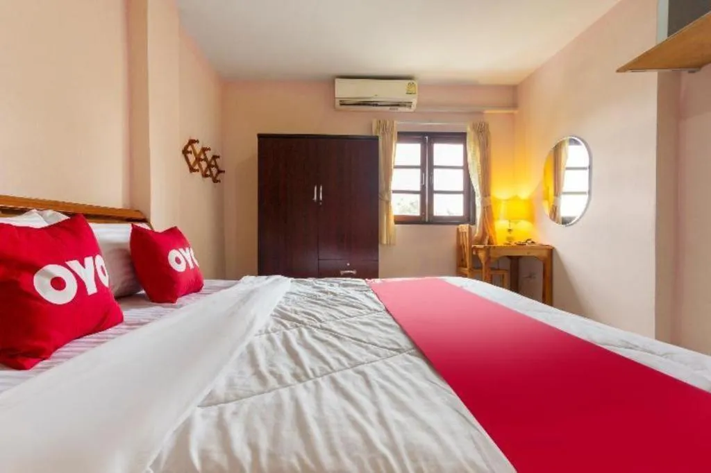 Bed in OYO 75356 Thipsiri Lodge