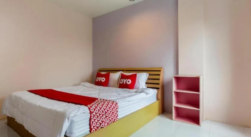 Bed in OYO 75356 Thipsiri Lodge