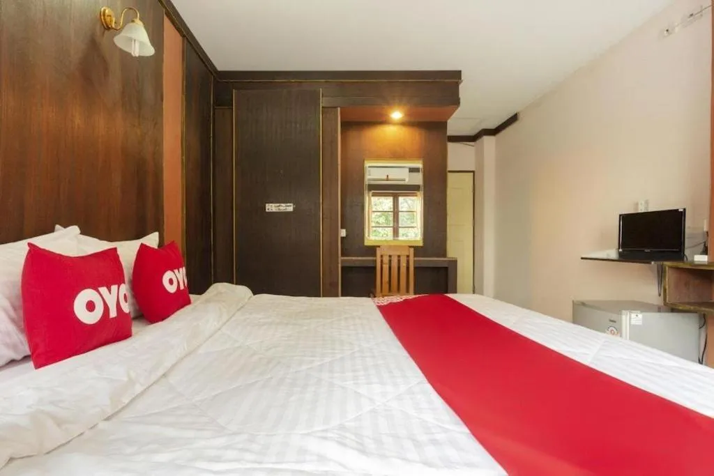 Bed in OYO 75356 Thipsiri Lodge