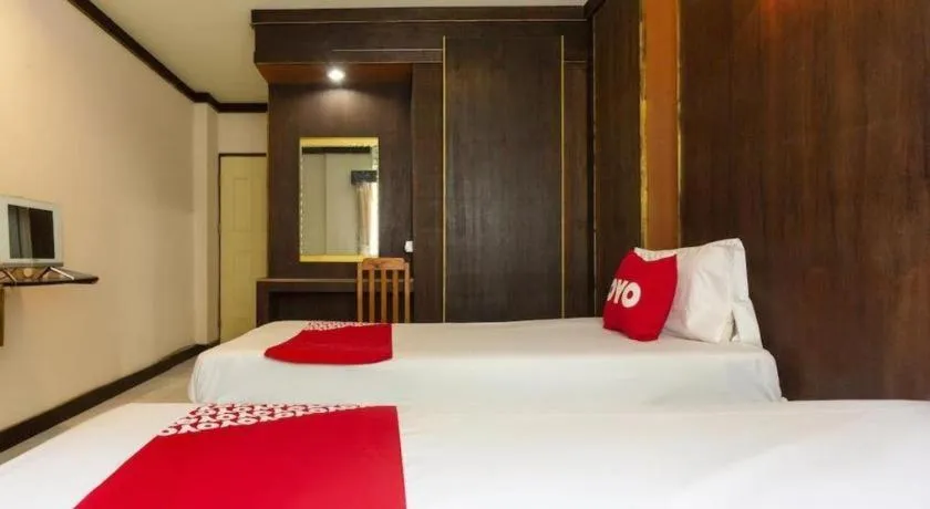 Bed in OYO 75356 Thipsiri Lodge