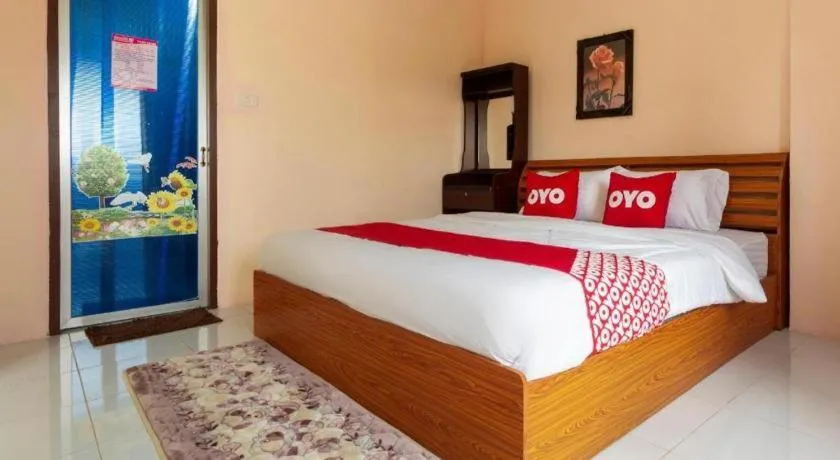 Bed in OYO 75356 Thipsiri Lodge