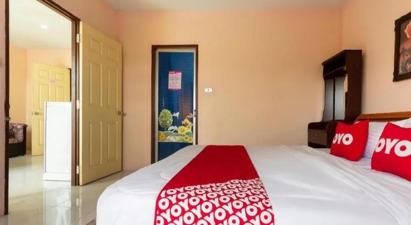 Bed in OYO 75356 Thipsiri Lodge