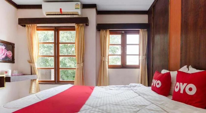 Bed in OYO 75356 Thipsiri Lodge