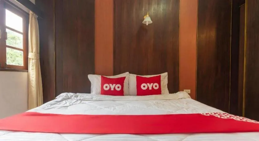 Bed in OYO 75356 Thipsiri Lodge
