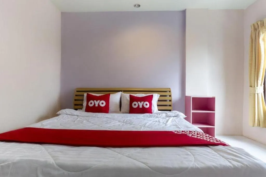 Bed in OYO 75356 Thipsiri Lodge