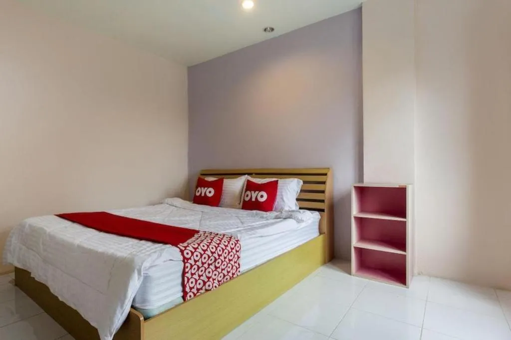 Bed in OYO 75356 Thipsiri Lodge