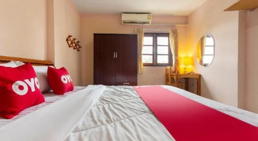 Bed in OYO 75356 Thipsiri Lodge
