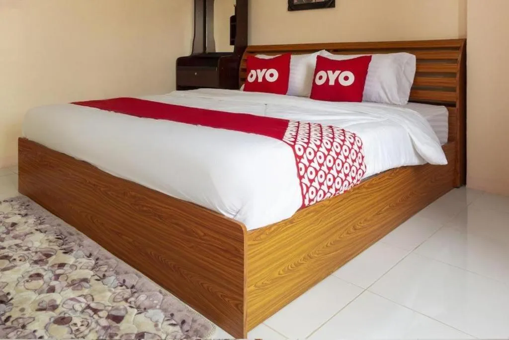 Bed in OYO 75356 Thipsiri Lodge