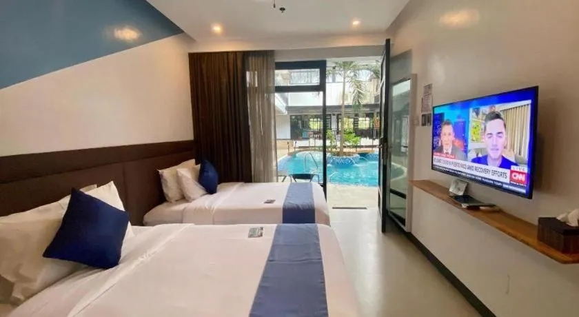 Bed in White Breeze Palawan Boutique Hotel