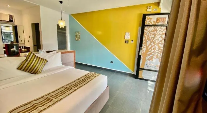 Bed in White Breeze Palawan Boutique Hotel