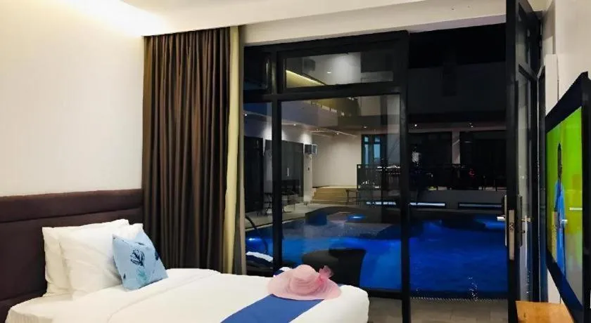 Bed in White Breeze Palawan Boutique Hotel