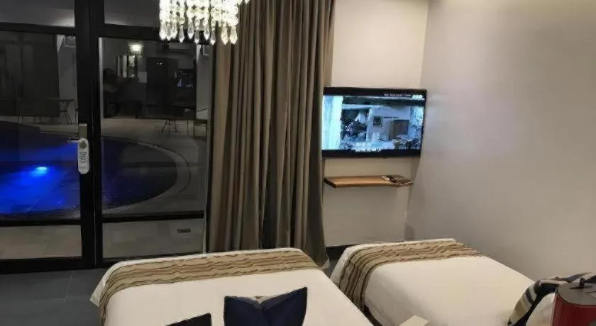 Bed in White Breeze Palawan Boutique Hotel