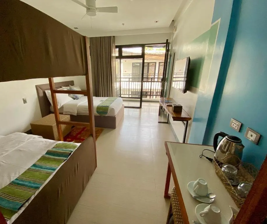 Bed in White Breeze Palawan Boutique Hotel