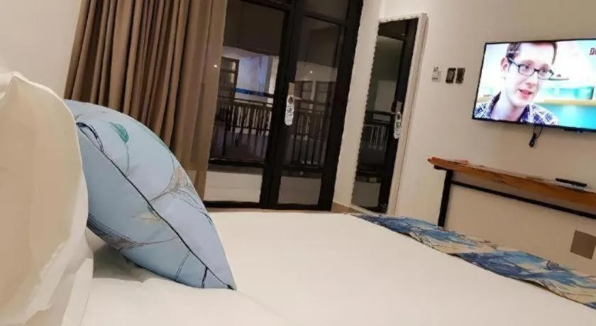 Bed in White Breeze Palawan Boutique Hotel