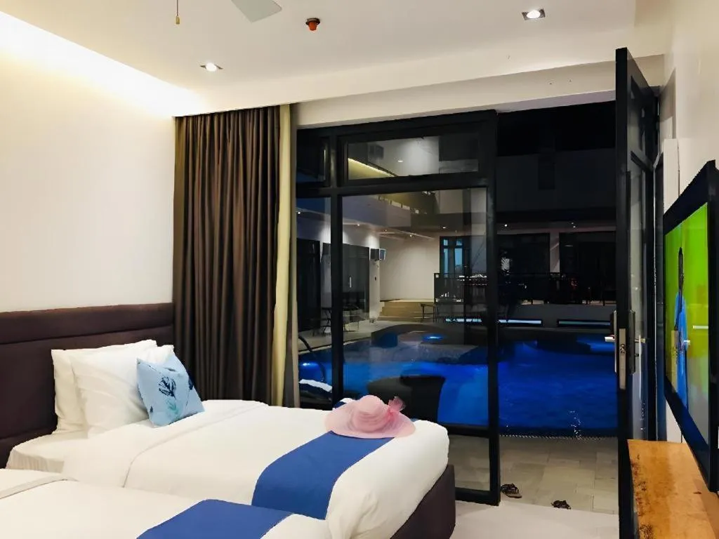 Bed in White Breeze Palawan Boutique Hotel