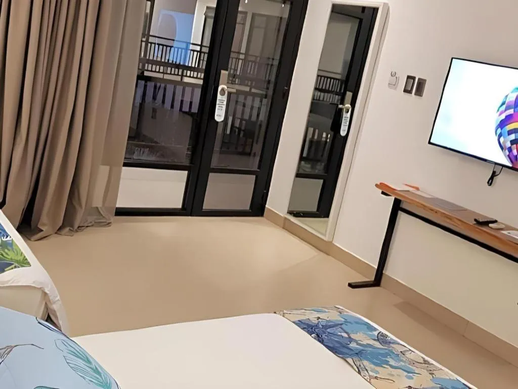 Bed in White Breeze Palawan Boutique Hotel