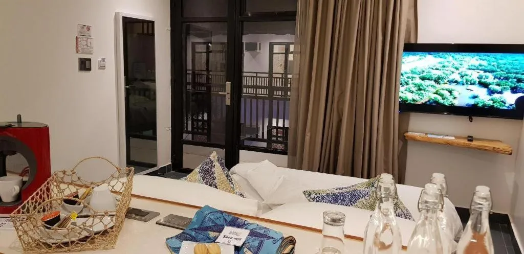 Bed in White Breeze Palawan Boutique Hotel