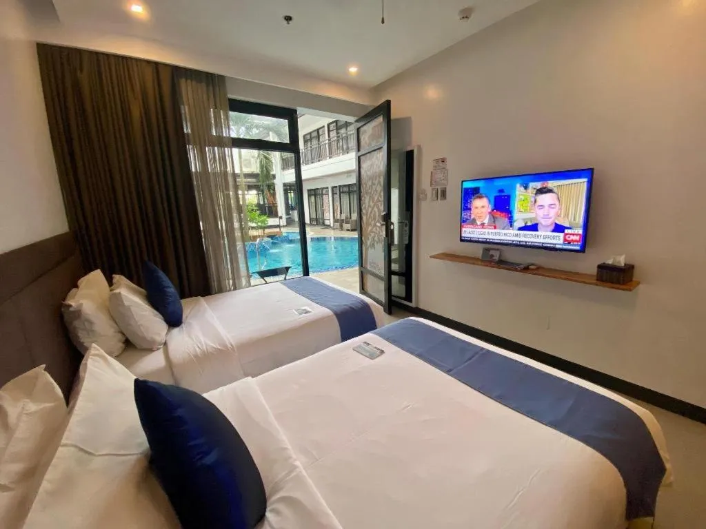 Bed in White Breeze Palawan Boutique Hotel