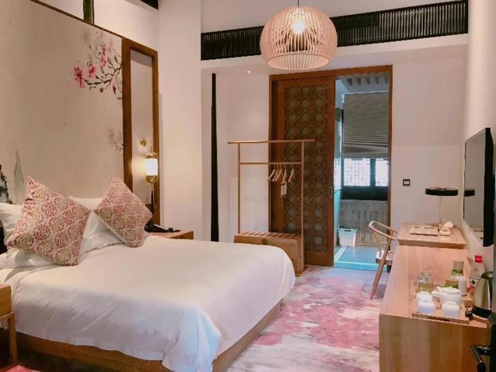 Bed in Blossom Hill Inn Suzhou Tanhuafu