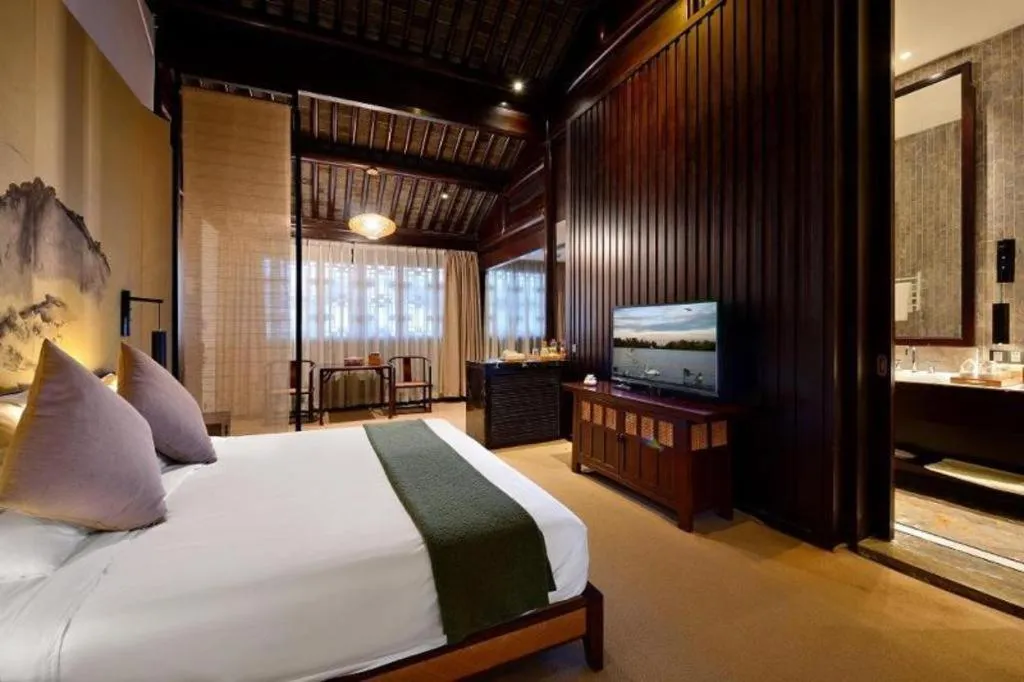 Bed in Blossom Hill Inn Suzhou Tanhuafu