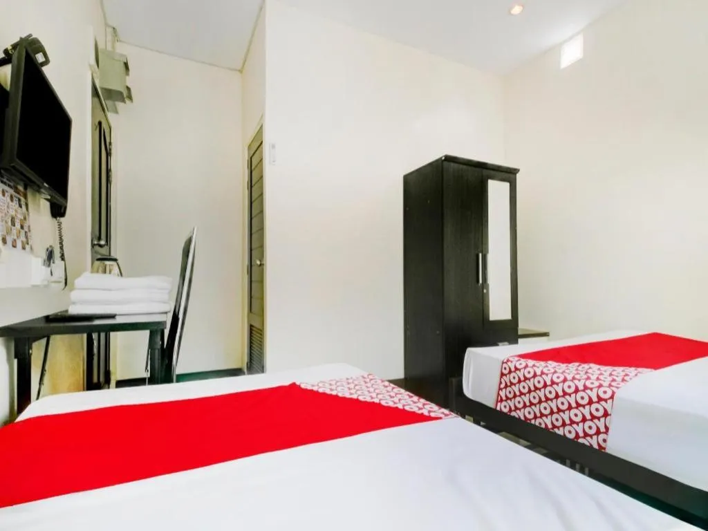 Bed in OYO 253 KK 11 Boutique Inn