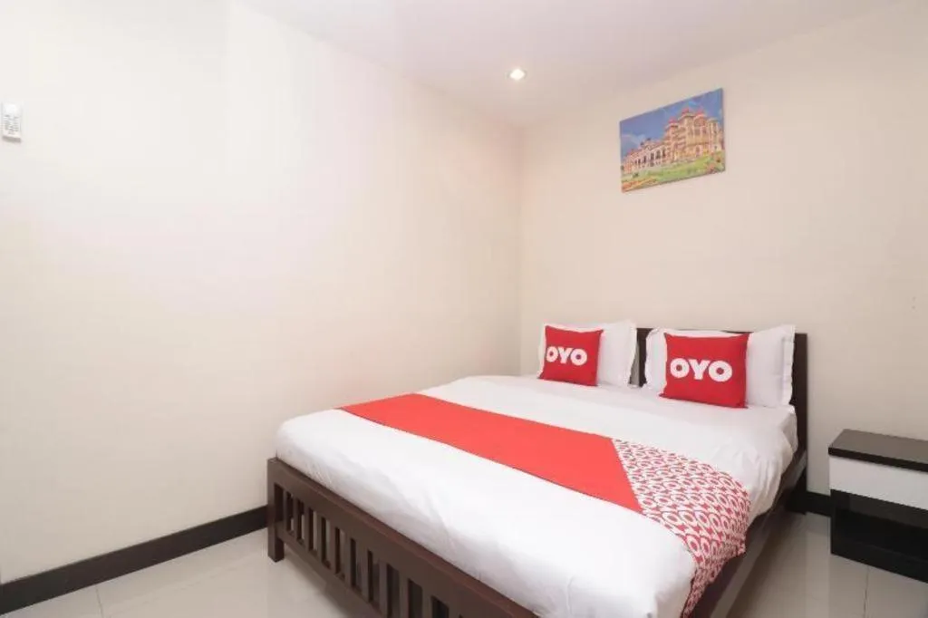 Bed in OYO 253 KK 11 Boutique Inn