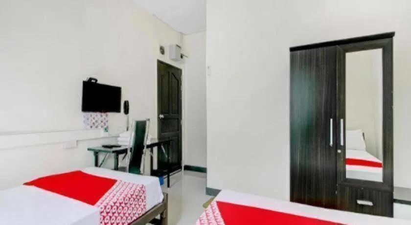 Bed in OYO 253 KK 11 Boutique Inn