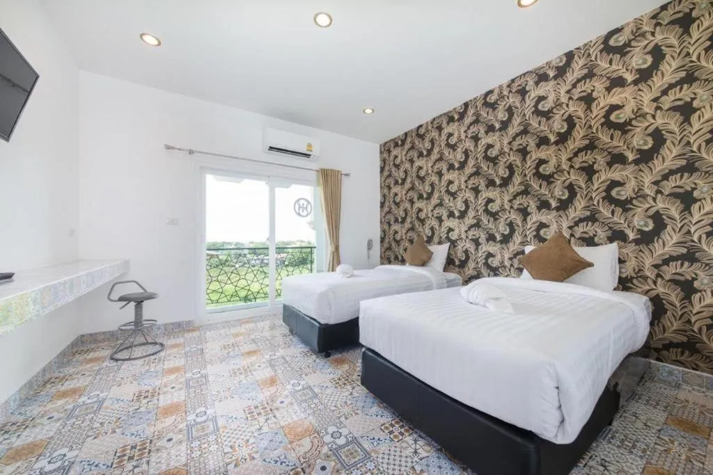 Bed in Oasis Hiso Hotel