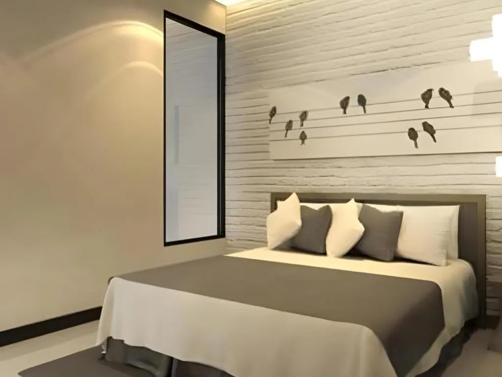 Bed in Oasis Hiso Hotel