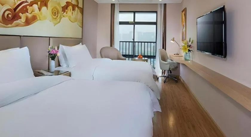 Bed in Vienna Hotel Nanning Xiangsi Lake University Town