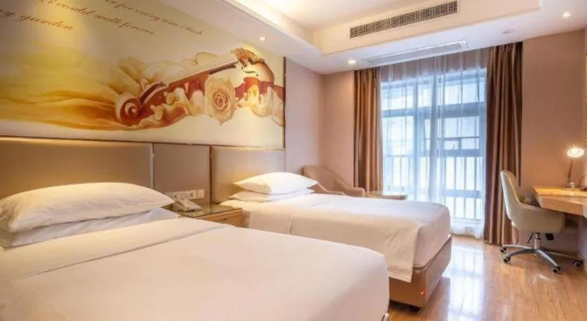 Bed in Vienna Hotel Nanning Xiangsi Lake University Town