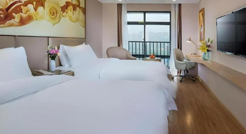 Bed in Vienna Hotel Nanning Xiangsi Lake University Town