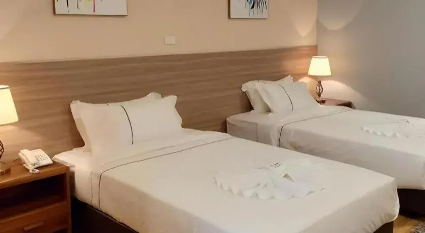 Bed in One Vientiane Hotel Bed in One Vientiane Hotel