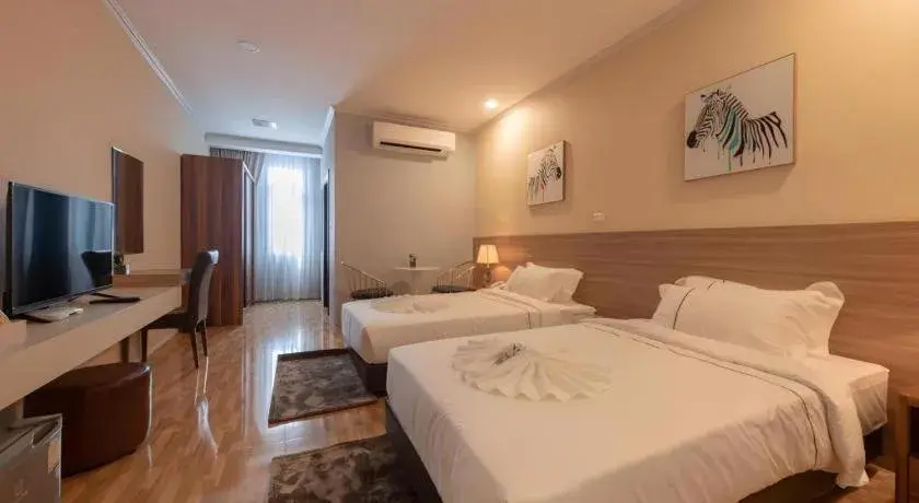 Bed in One Vientiane Hotel Bed in One Vientiane Hotel