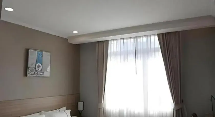 Bed in One Vientiane Hotel Bed in One Vientiane Hotel