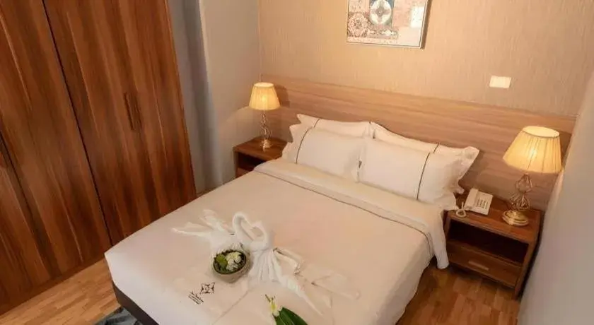 Bed in One Vientiane Hotel Bed in One Vientiane Hotel