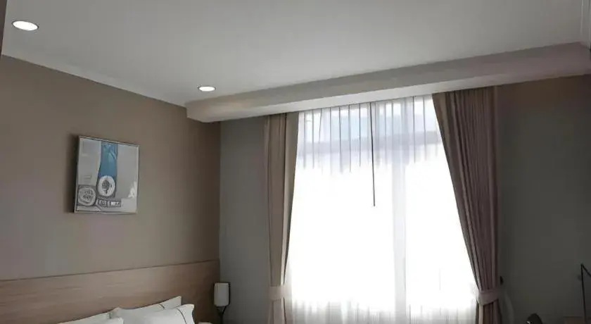 Bed in One Vientiane Hotel Bed in One Vientiane Hotel