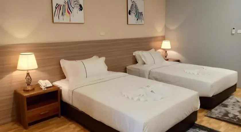 Bed in One Vientiane Hotel Bed in One Vientiane Hotel