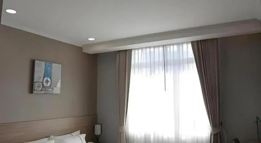 Bed in One Vientiane Hotel Bed in One Vientiane Hotel